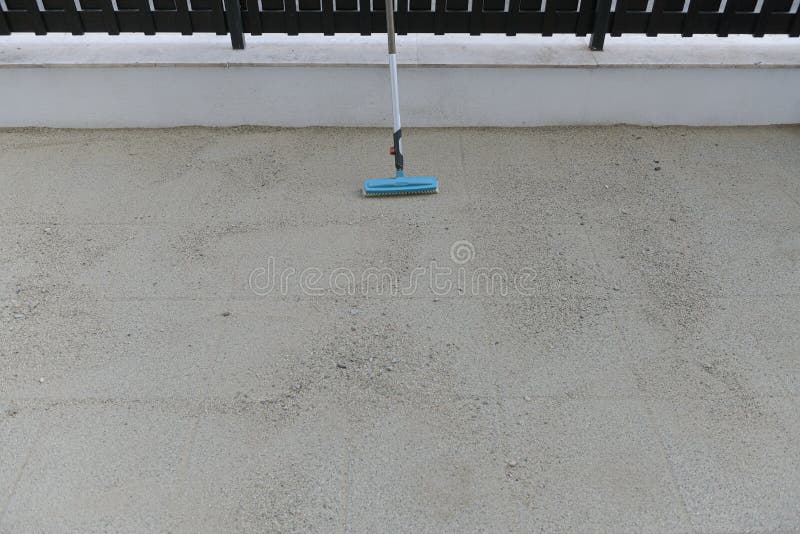 Garden Broom. Tools for Landscaping. Cleaning the Pavers from Sand