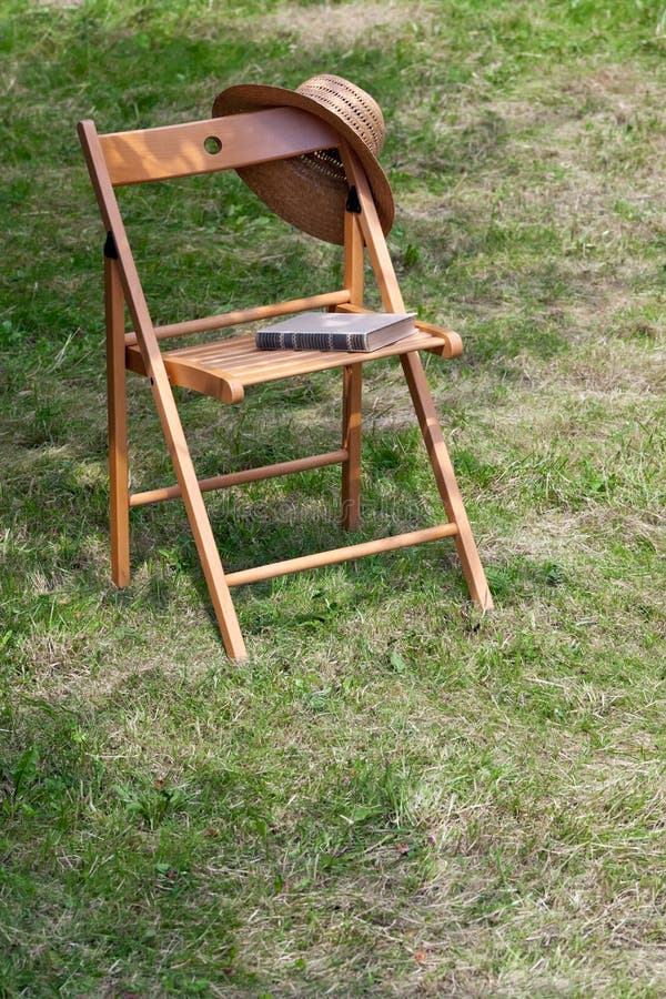 Garden chair stock photo. Image of book, sunlight, view 19302860