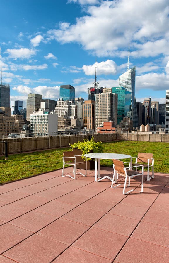 Garden furniture on a sunny rooftop patio