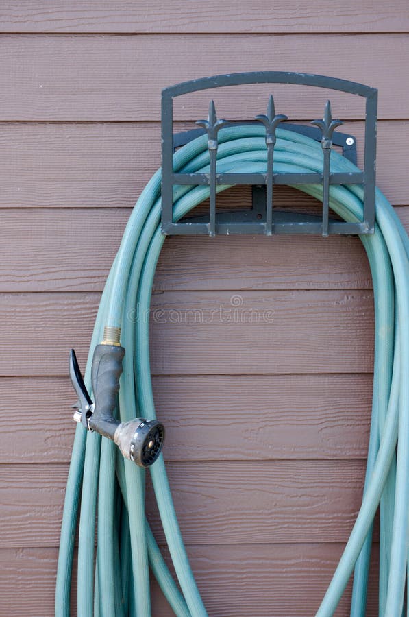 Garden hose with sprayer stock image. Image of garden 21189199