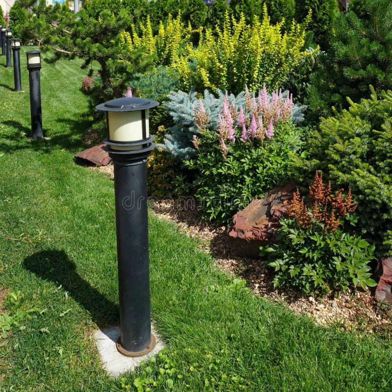 Garden lamp on a green grass