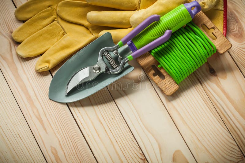 Garden Tools Hand Spade Secateurs Roupe Gloves on Wood Stock Image