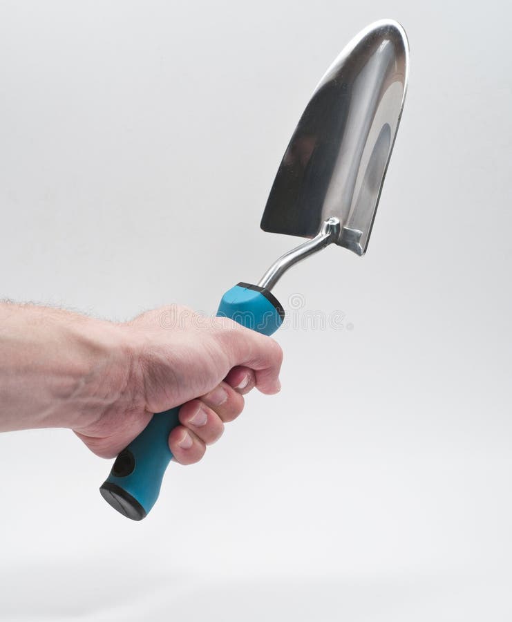 Garden trowel held vertically