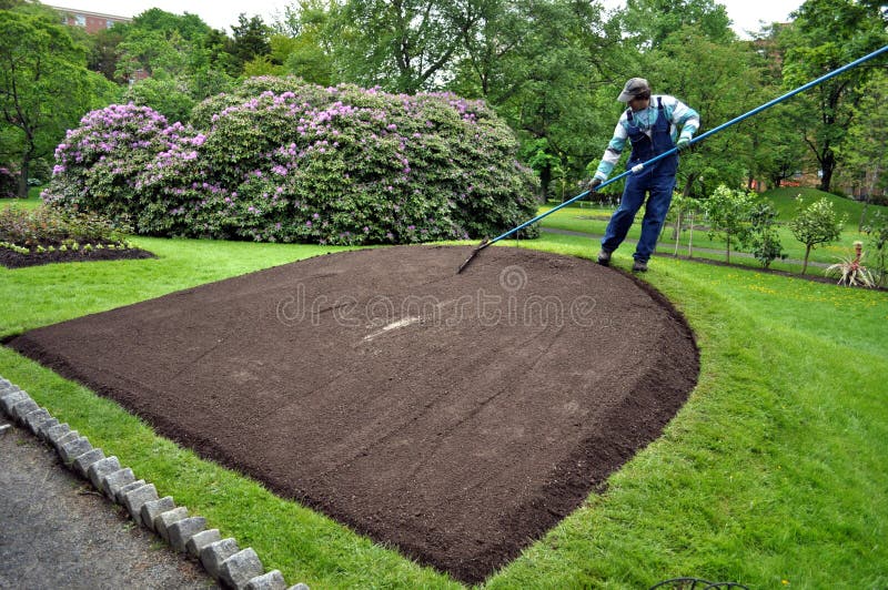 Gardener Tending Flower Bed In Halifax Public Gardens Nova Scotia