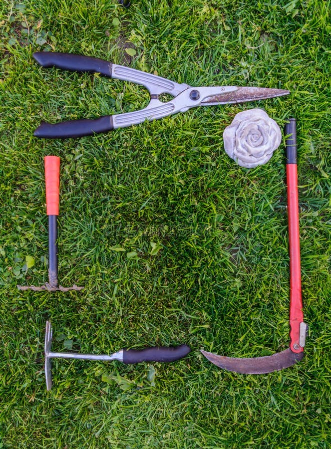 Gardening Tools on Green Grass in the Garden Stock Photo Image of