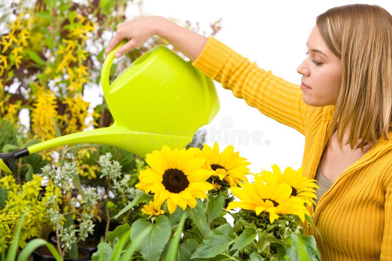 Gardening - woman pouring water to flowers