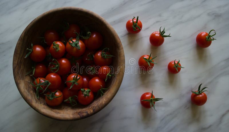 Gardens Delight Tomatoes In Bowl And Spread On Table Stock Photo