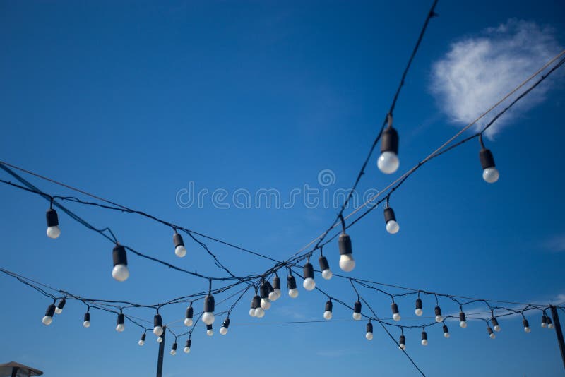 Garland of Street Light Bulb Decor on Sky Background Stock Photo ...