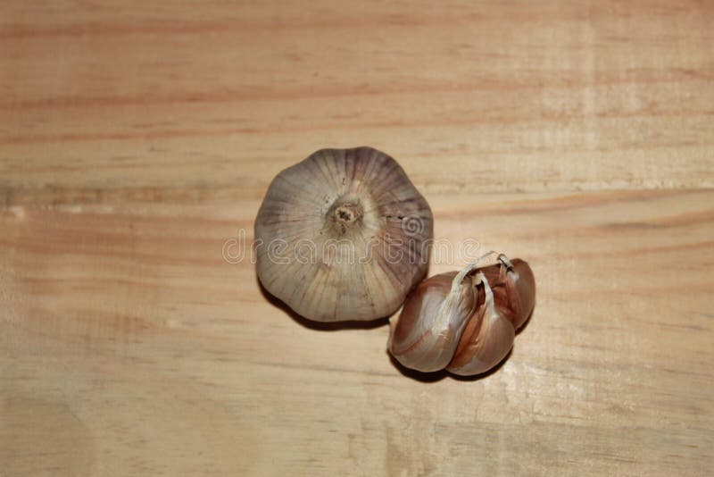 A Garlic Bulb on the Wooden Background Stock Photo Image of soil, pieces 206186356