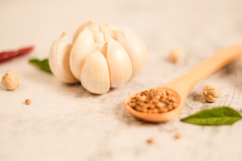 Garlic Clove on Stone Top View .Flat Lay Composition with Herb and Nut