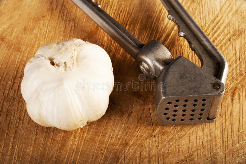 Garlic crusher stock image. Image of cookery, herb, utensil 45074949