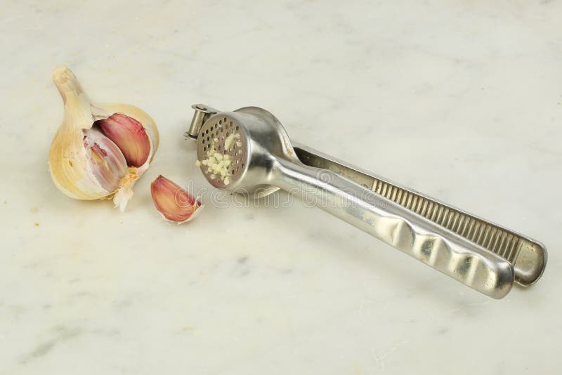 Garlic and grater stock image. Image of work, implement 192621725