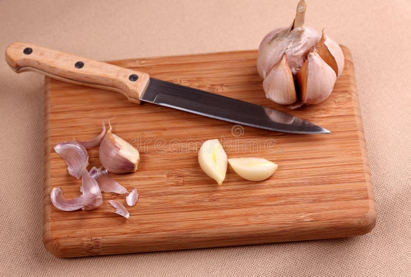 Garlic and Knife on Cutting Board Stock Image Image of horizontal