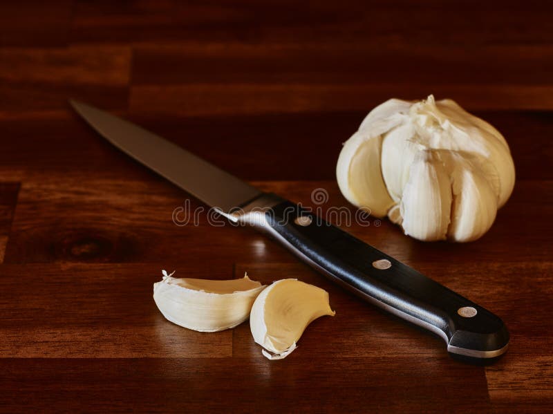 Garlic and knife stock photo. Image of texture, aromatic 89642846