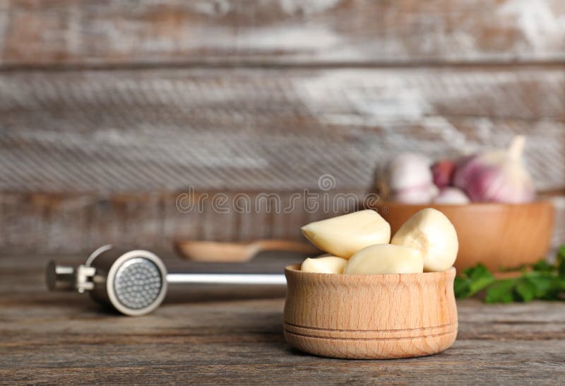 Garlic Press and Bowl with Cloves Stock Photo Image of garlic