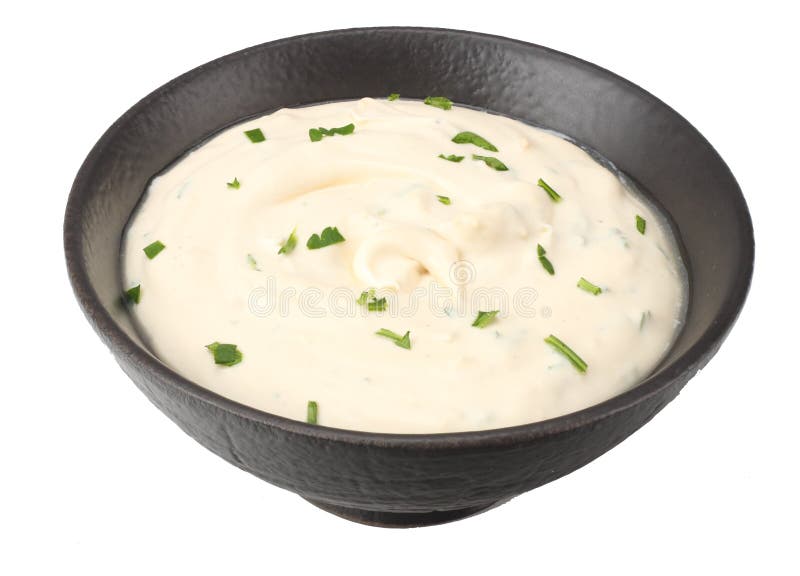 garlic sauce in black bowl isolated on white background