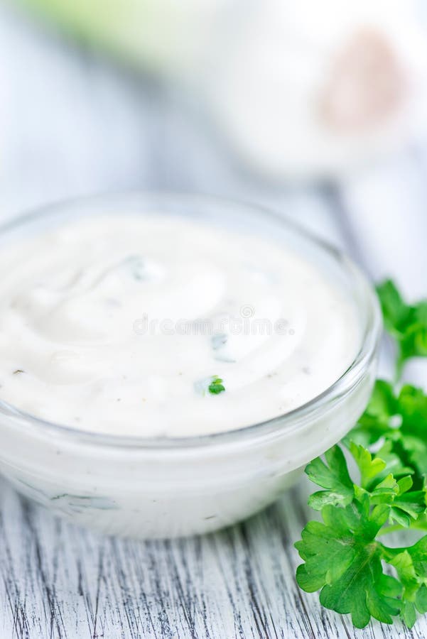 Garlic Sauce With Some Fresh Herbs Stock Photo Image of garlic, cream 71853858