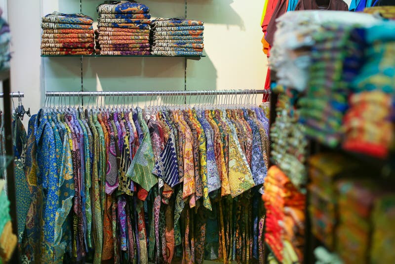 Indian Man Presenting Frock Design at Local Garments Shop in India