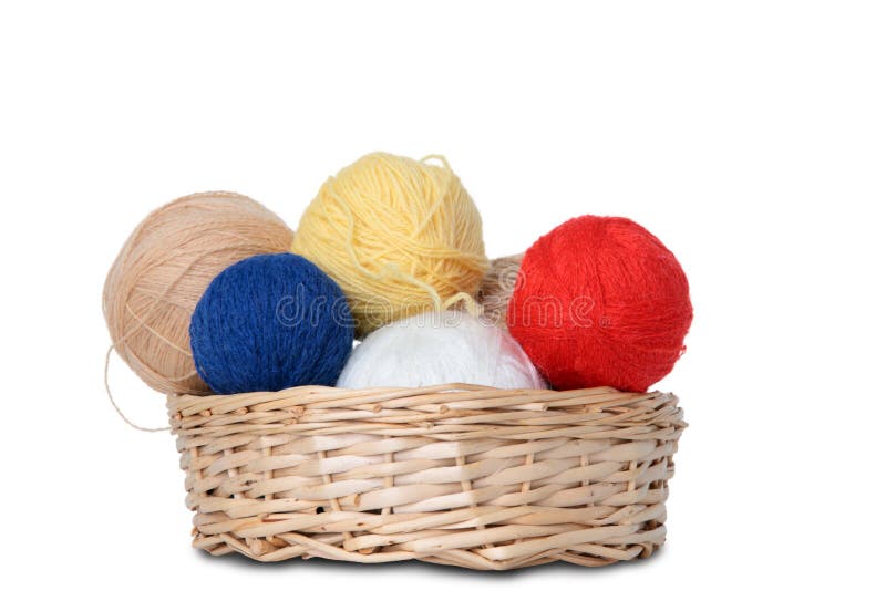 Multi-coloured hanks of a yarn in a wattled basket. Multi-coloured hanks of a yarn in a wattled basket