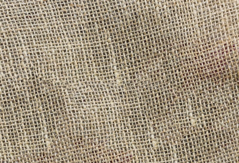 Garnering för stil för homespun brun eco för naturligt tyg materiell royaltyfri foto Garnering för stil för homespun brun eco för naturligt tyg materiell royaltyfri foto