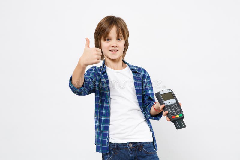 Kid boy in blue t-shirt hold wireless bank payment terminal to process and acquire credit card payments isolated on white wall background children studio portrait. People childhood lifestyle concept. Kid boy in blue t-shirt hold wireless bank payment terminal to process and acquire credit card payments isolated on white wall background children studio portrait. People childhood lifestyle concept