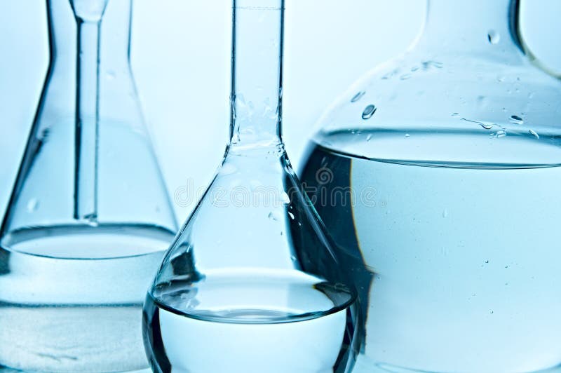 Glass flasks on black background. Glass flasks on black background