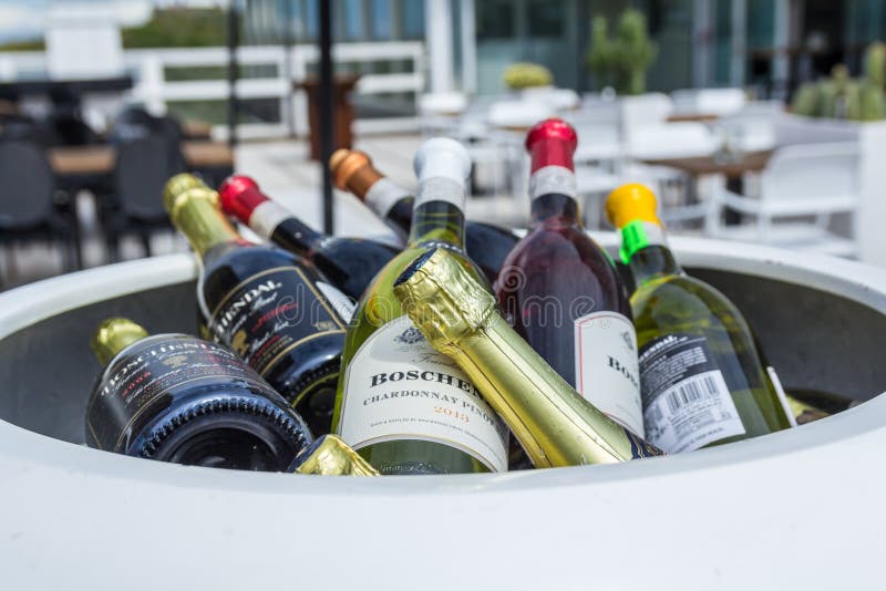 Kijkduin , the Netherlands - July 30, 2016: wine bottles in a cool box at a beach side hotel. Kijkduin , the Netherlands - July 30, 2016: wine bottles in a cool box at a beach side hotel