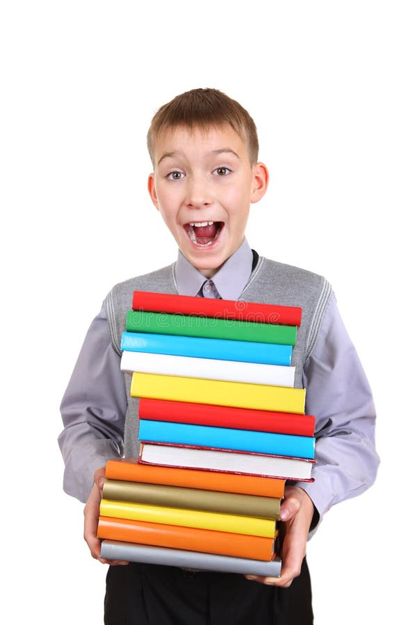 Garçon tenant la pile des livres photographie stock libre de droits Garçon tenant la pile des livres photographie stock libre de droits