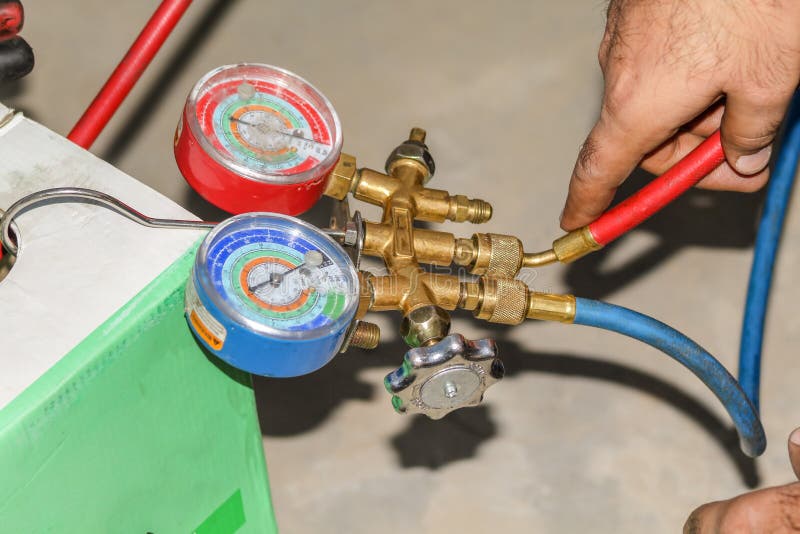 Gas is Being Refiling into the Heavy Ac Compressor of Central Air