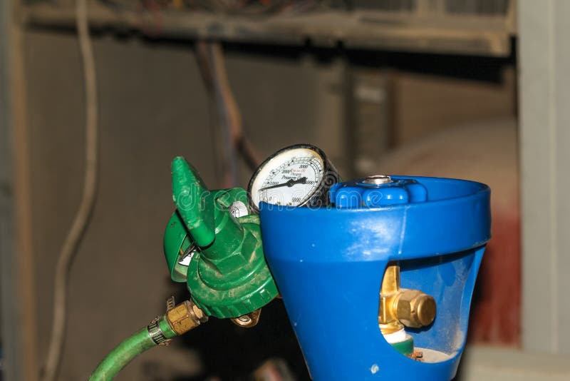 Gas is Being Refiling into the Heavy Ac Compressor of Central Air