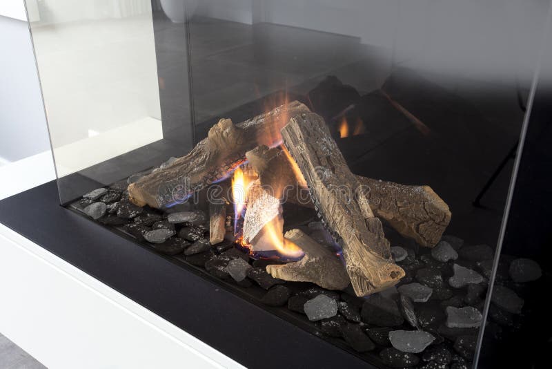 Gas fireplace with white mantel modern interior luxury design, close-up in a modern home