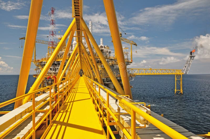 The gas flare is on the oil rig platform stock image The gas flare is on the oil rig platform stock image