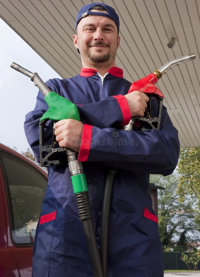Gas Jockey Refilling Car stock image. Image of filling 16604143