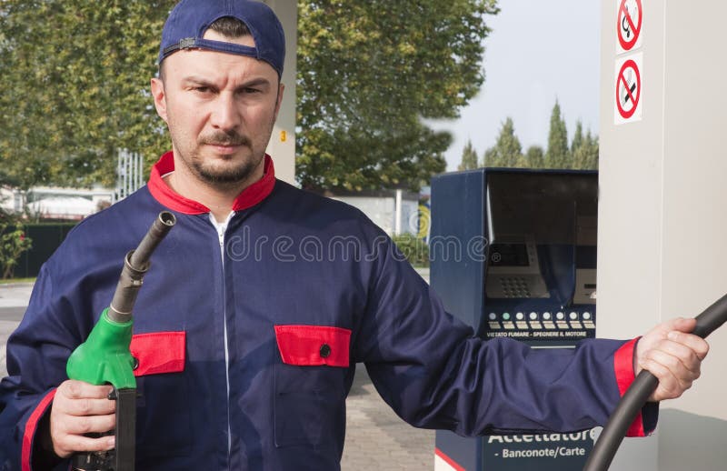 Gas Jockey Refilling Car stock image. Image of hose, petrol 16651443