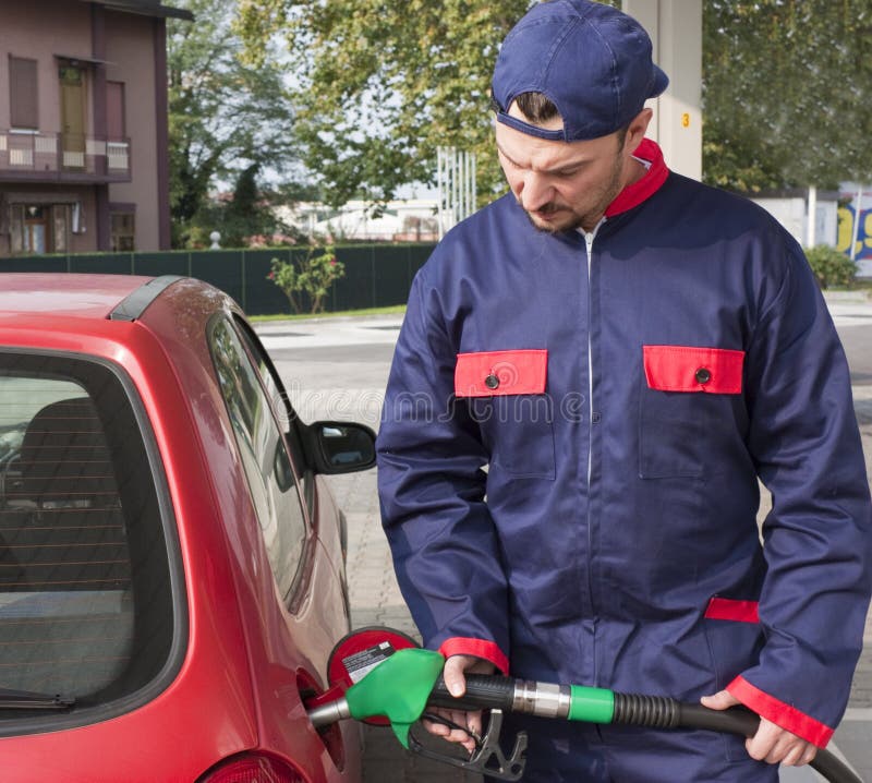 Gas Jockey Refilling Car stock image. Image of hose, diesel 16686339