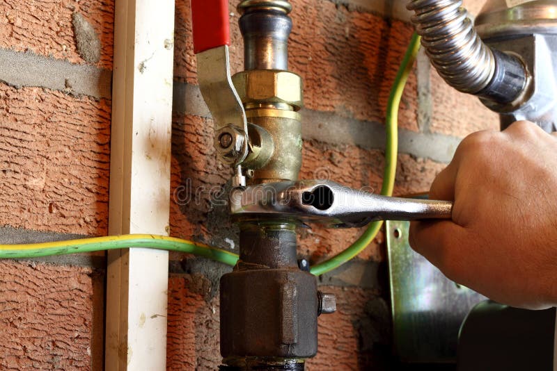 Gas pipe man connecting stock photo. Image of leak, maintenance 65539222