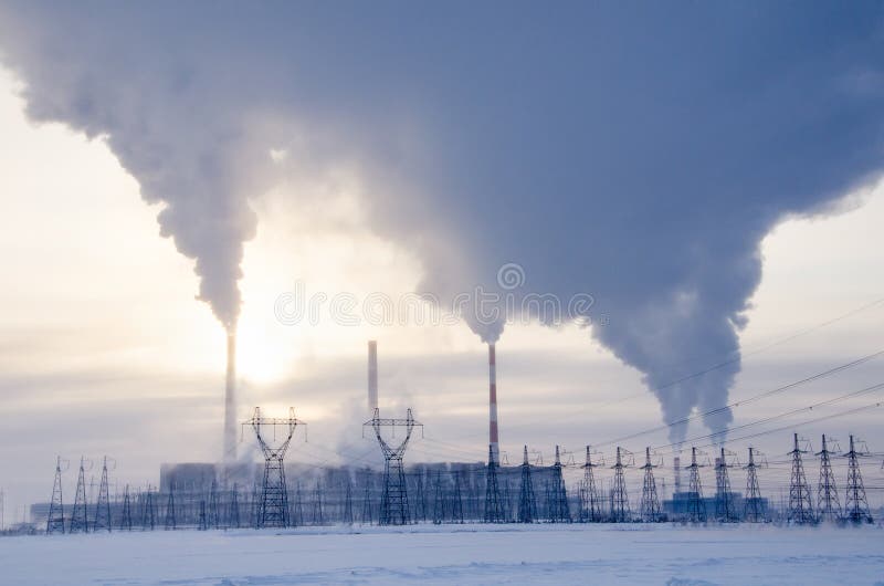 Gas power plant in cold winter landscape during sunset