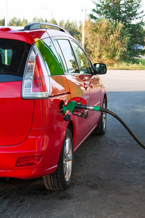 Gas Pump Nozzle in the Fuel Tank of a Car. Stock Image Image of