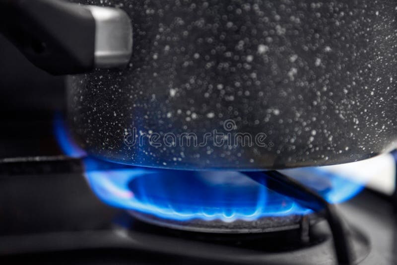 Gas Stove with an Open Blue Flame, Cook on it Dish in Ladle Stock Image Image of kitchen