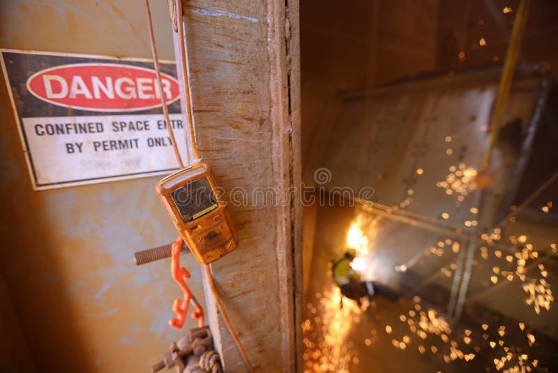 Gas tester detector atmosphere hanging at confined space entry and exit man hole door continue monitoring