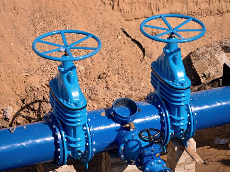 Gate valves underground, water pipeline valve on a blue pipeline after reconstruction.