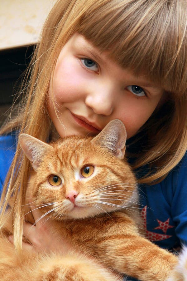 Yong cute girl holding lovely cat. Yong cute girl holding lovely cat.