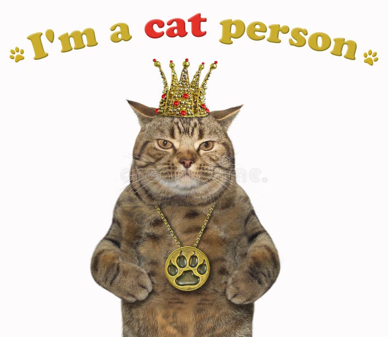 The cat is wearing a crown and a locket. I`m a cat person. White background. The cat is wearing a crown and a locket. I`m a cat person. White background.