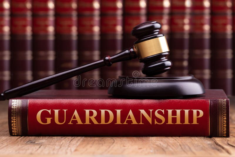 Gavel And Striking Block Over Guardianship Law Book. Judge Gavel And Striking Block Over Law Book With Guardianship Law Text On Wooden Desk stock images