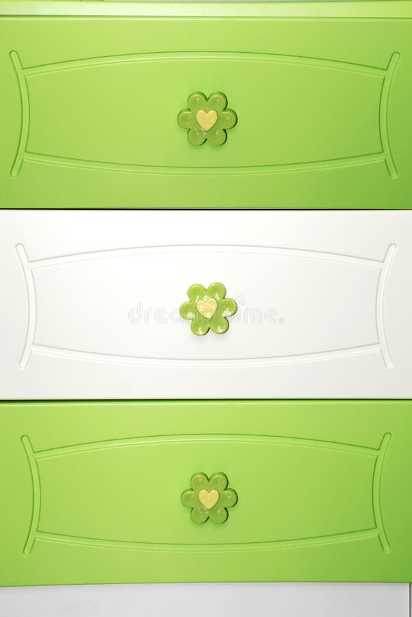 Close up green dresser drawers. Close up green dresser drawers