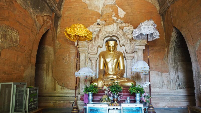 The Gawdawpalin Temple, A buddha statue in the corridor of the 11th century Gawdawpalin temple in Old Bagan in Myanmar. The Gawdawpalin Temple, A buddha statue in the corridor of the 11th century Gawdawpalin temple in Old Bagan in Myanmar.