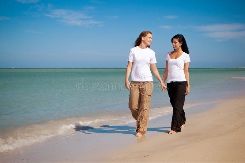Gay couple at the beach stock image