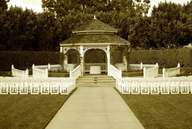 Beautiful gazebo with chairs for wedding in old style sepia tone photography. Beautiful gazebo with chairs for wedding in old style sepia tone photography