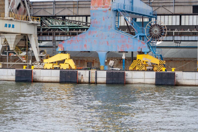 Gdansk, Poland - June 18, 2022: Industrial crane and machinery at harbor, showcasing loading and unloading operations at royalty free stock photo