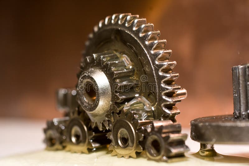 Planetrary gears standing up with oil all over them. Power tech stock images, royalty-free photos and pictures